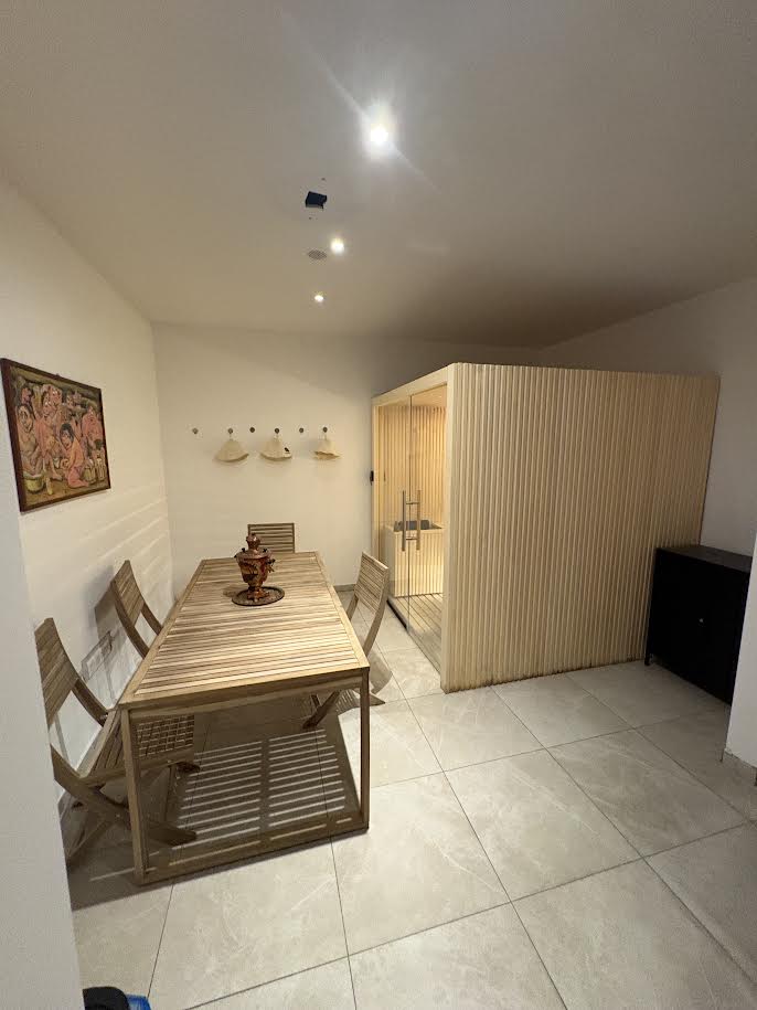 Sauna and relaxation lounge with wooden table